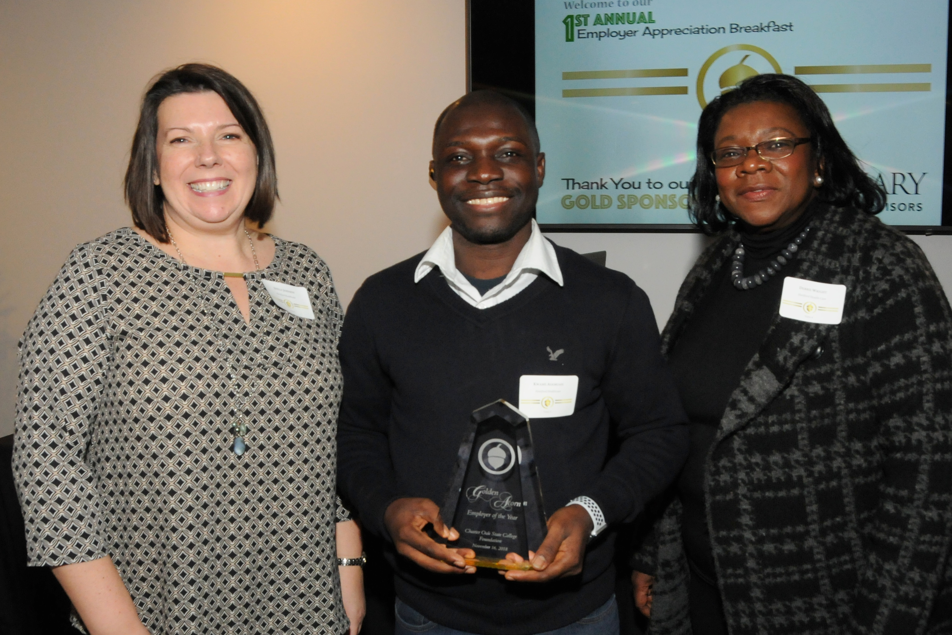 The 2018 Golden Acorn Employer of the Year - Hartford Healthcare!  From left to right, Shelly Johnson, Kwame Asamoah, COSC Student and Scholarship Recipient, Debbi Wright, RHIA, System Director of Health Information Management and Guest Speaker. (Missing from the picture is supervisor, Celia Rodriguez.)