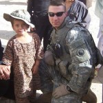 Bryan Kowalsky - 2010 Dingwall Scholarship Recipient. This picture is of Bryan during his deployment in Afghanistan. He is with an Afghan girl wearing his boonie cap.